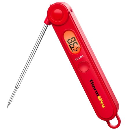 A red digital thermometer featuring a sleek design and a pointed probe for accurate temperature readings.